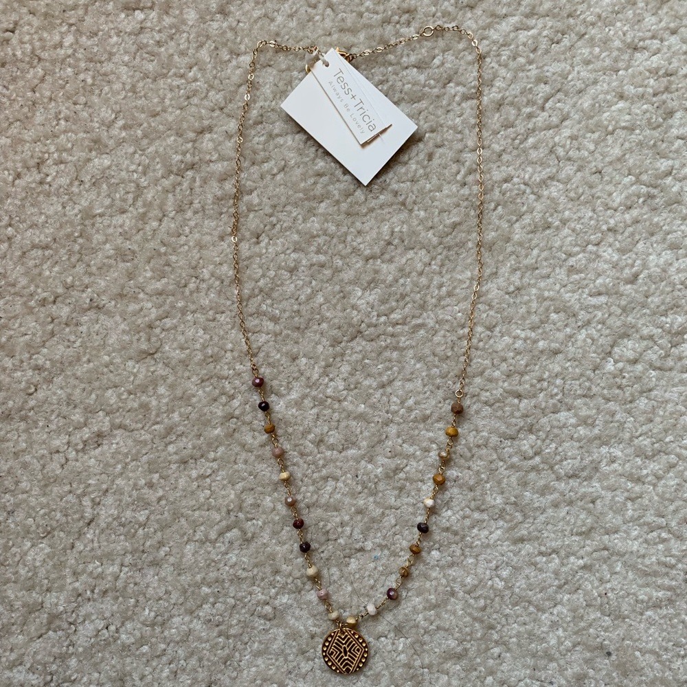 Gold neutral bead necklace with gold charm